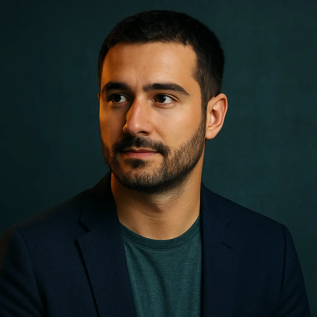 Portrait of a young Turkish man in a navy blazer with a green shirt, looking confidently to the side against a dark teal background, representing Cem Yilmaz.